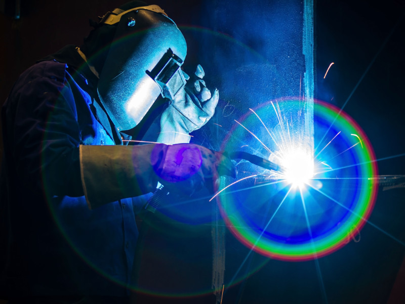 A close up of a welder in action